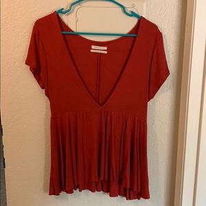 Brick red v neck shirt